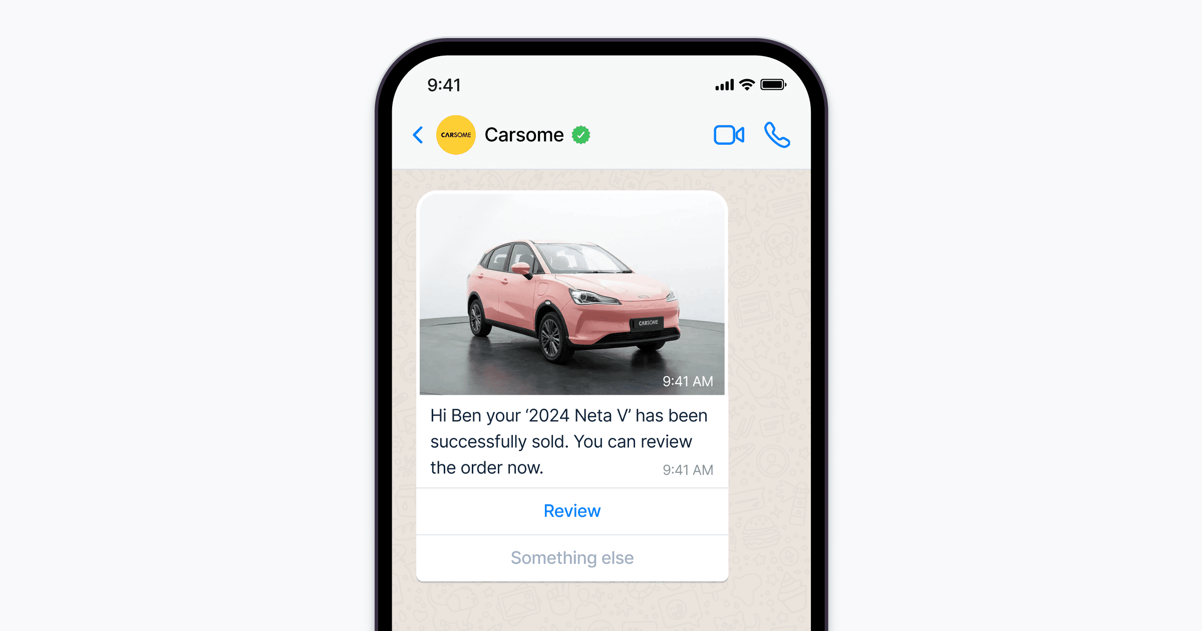 A smartphone screen displays a Carsome chat message confirming the successful sale of a 2024 Neta V, with an image of the pink car above buttons for review and alternative options.