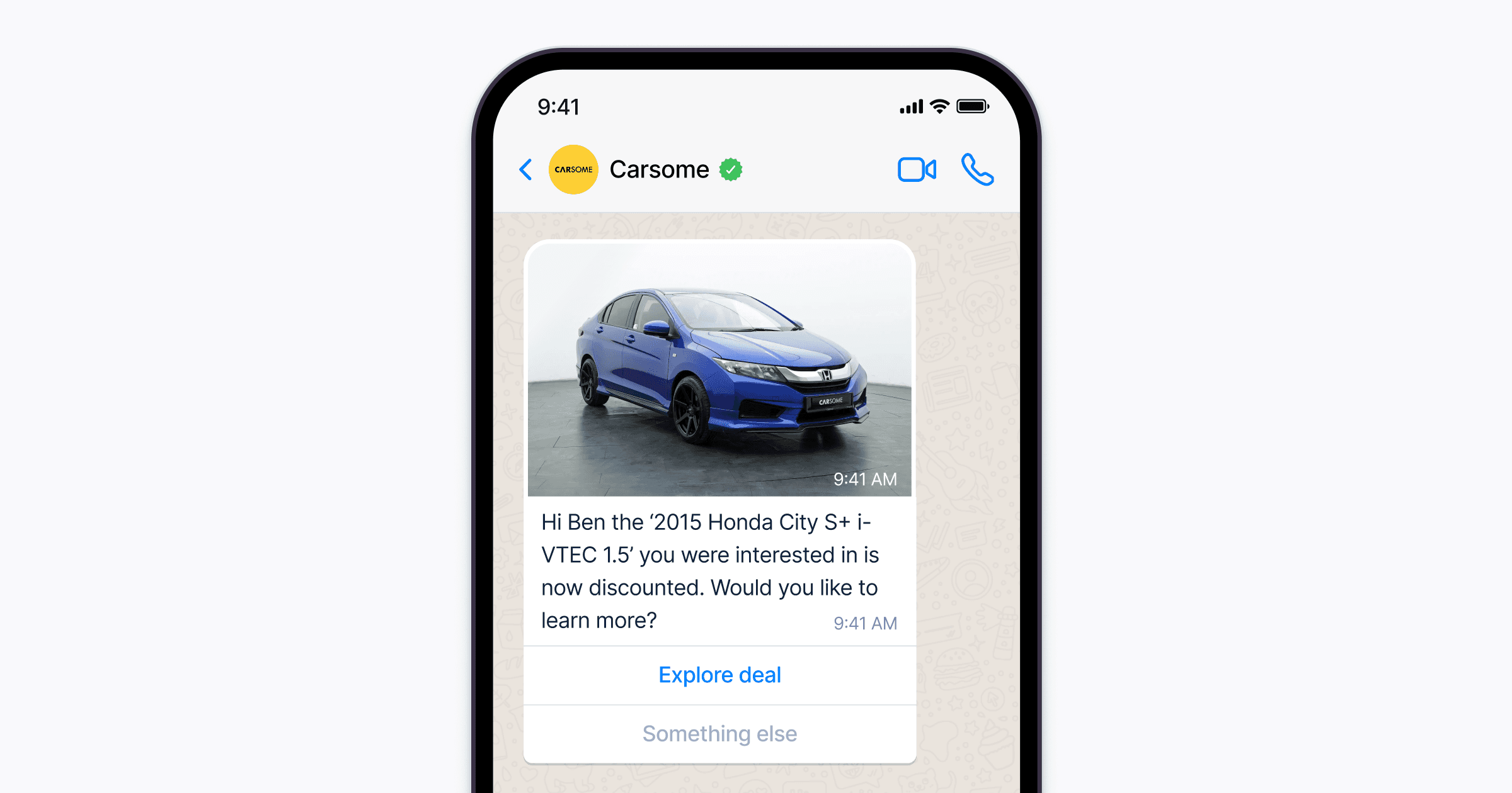 A smartphone screen displays a messaging app with a notification about a discounted 2015 Honda City S+ i-VTEC 1.5, featuring an image of a blue car and an option to "Explore deal," highlighting a promotion on Carsome.